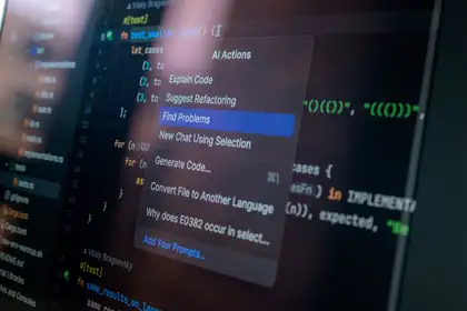 A code editor mid-build, an actions menu open over the file being worked on.